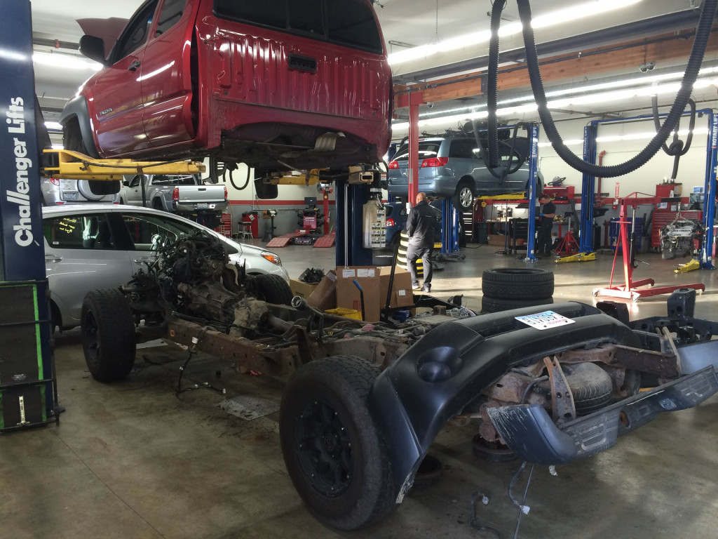 A Toyota Tacoma sits in pieces during the Frame Rust Recall
