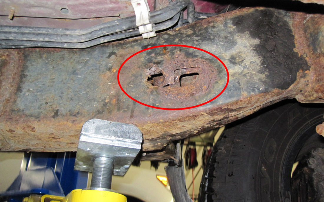 A hole in the frame of a recalled Toyota Tacoma